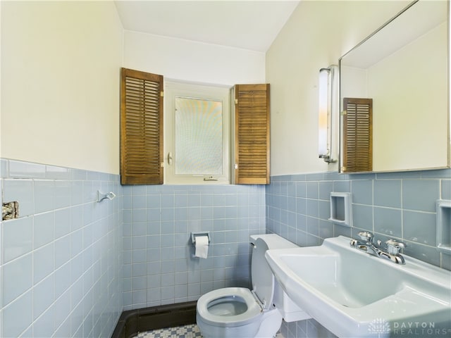 2120 Wyoming St, Dayton, OH 45410 - half bathroom featuring tile walls and a wainscoted wall