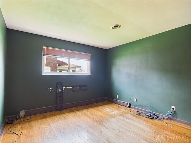 2120 Wyoming St, Dayton, OH 45410 - spare room featuring hardwood / wood-style floors and baseboards