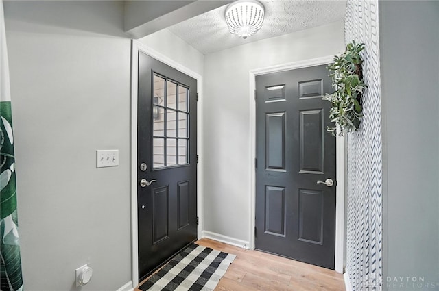 8052 Timberlodge Trl, Washington Twp, OH 45458 - foyer featuring light wood-style floors and a textured ceiling