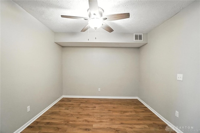 8052 Timberlodge Trl, Washington Twp, OH 45458 - empty room with a ceiling fan, a textured ceiling, and wood finished floors