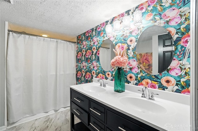 8052 Timberlodge Trl, Washington Twp, OH 45458 - full bathroom featuring wallpapered walls, double vanity, a textured ceiling, and a shower with shower curtain