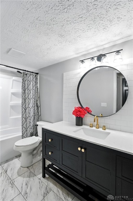 8052 Timberlodge Trl, Washington Twp, OH 45458 - bathroom with vanity, a textured ceiling, tasteful backsplash, shower / bath combination with curtain, and marble finish floors