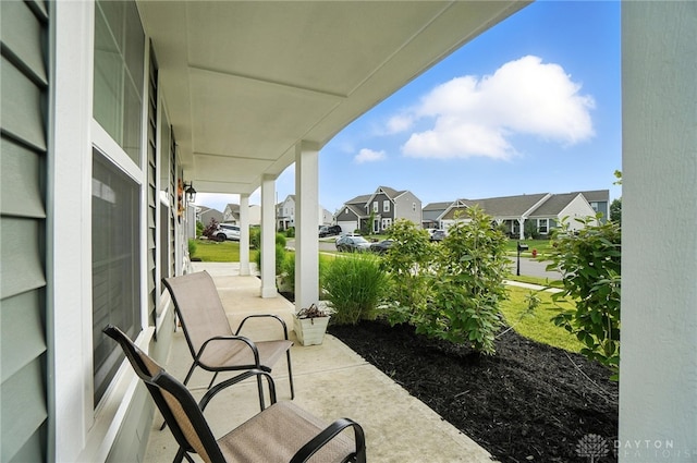 166 Brooke Parke Ave, Brookville, OH 45309 - covered porch featuring a residential view