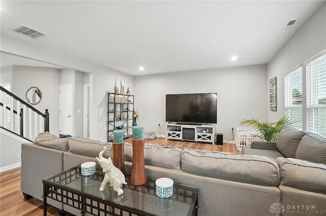 166 Brooke Parke Ave, Brookville, OH 45309 - living room with wood finished floors, stairway, and recessed lighting