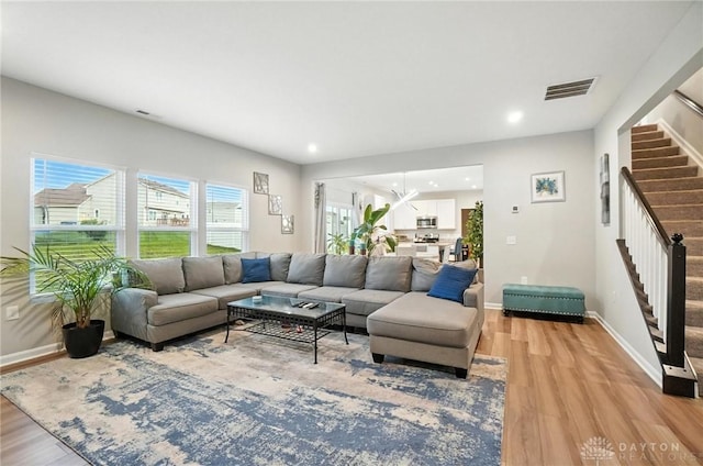 166 Brooke Parke Ave, Brookville, OH 45309 - living room with stairs, light wood-style floors, and recessed lighting