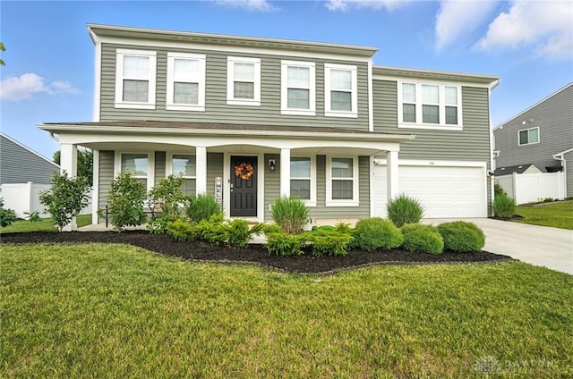 166 Brooke Parke Ave, Brookville, OH 45309 - view of front facade featuring concrete driveway, an attached garage, and covered porch