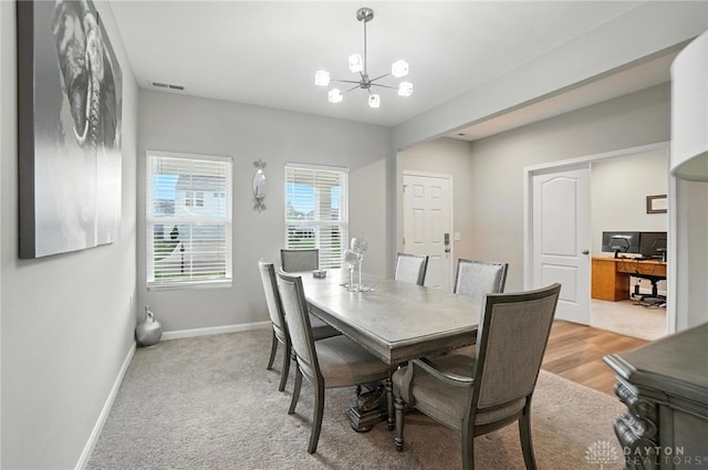 166 Brooke Parke Ave, Brookville, OH 45309 - dining area featuring a chandelier and baseboards