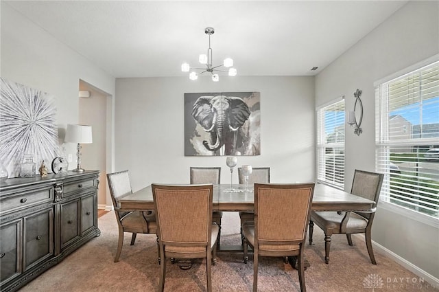 166 Brooke Parke Ave, Brookville, OH 45309 - dining room featuring a chandelier and light carpet