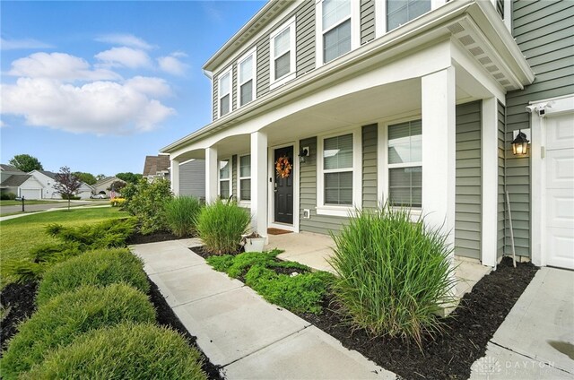 166 Brooke Parke Ave, Brookville, OH 45309 - property entrance with a porch and a garage