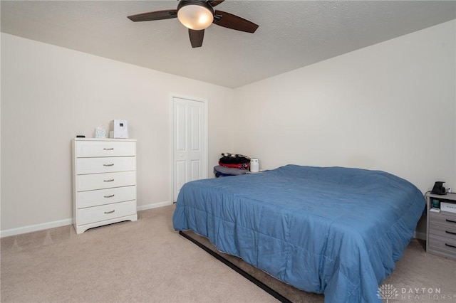 1009 Glen Kegley Dr, Xenia, OH 45385 - bedroom featuring light colored carpet, ceiling fan, and a closet