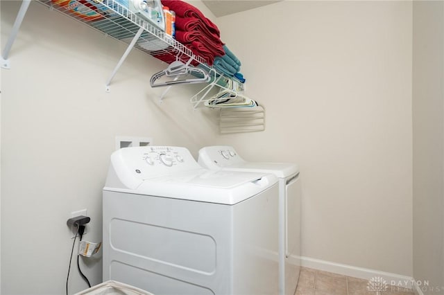 1009 Glen Kegley Dr, Xenia, OH 45385 - laundry room featuring independent washer and dryer and light tile patterned floors