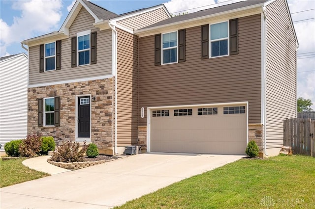 1009 Glen Kegley Dr, Xenia, OH 45385 - view of front of home with stone siding, a garage, and driveway