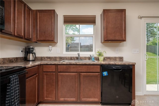 1009 Glen Kegley Dr, Xenia, OH 45385 - kitchen with black appliances and dark countertops