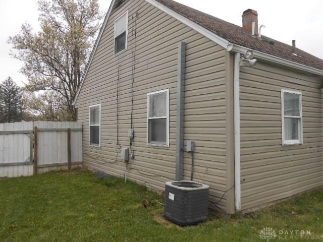 1930 Emerald Ct, Dayton, OH 45403 - view of side of property with a chimney and a central air condition unit