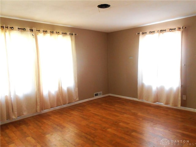 1930 Emerald Ct, Dayton, OH 45403 - spare room featuring wood finished floors and baseboards