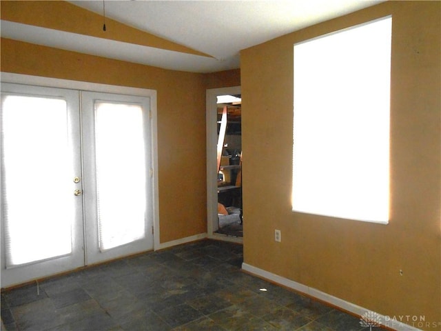 1930 Emerald Ct, Dayton, OH 45403 - spare room featuring french doors and vaulted ceiling