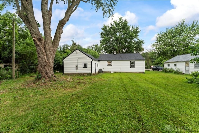 1209 Maple St, Troy, OH 45373 - back of house with a lawn