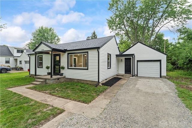 1209 Maple St, Troy, OH 45373 - view of front of property with a garage, driveway, a front lawn, and roof with shingles