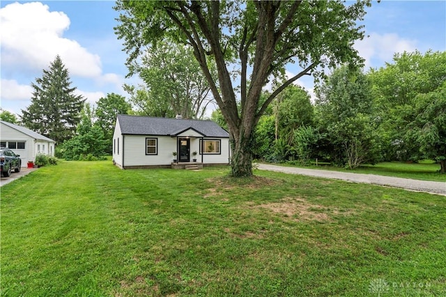 1209 Maple St, Troy, OH 45373 - view of front of house with a front lawn