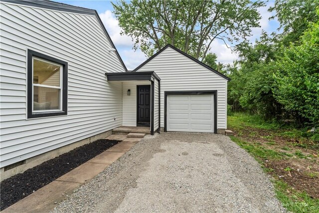 1209 Maple St, Troy, OH 45373 - view of front of home with driveway and an attached garage