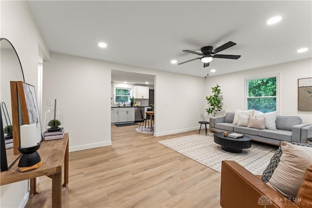 1209 Maple St, Troy, OH 45373 - living room featuring recessed lighting, ceiling fan, and light wood-type flooring