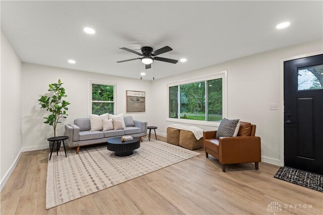 1209 Maple St, Troy, OH 45373 - living area featuring healthy amount of natural light, light wood finished floors, recessed lighting, and ceiling fan