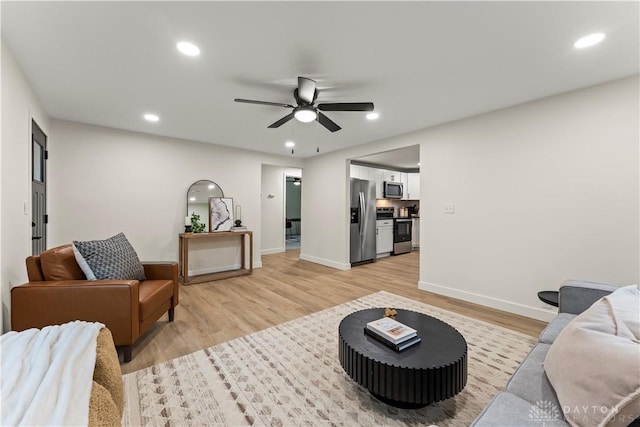 1209 Maple St, Troy, OH 45373 - living room with light wood-style flooring, ceiling fan, and recessed lighting