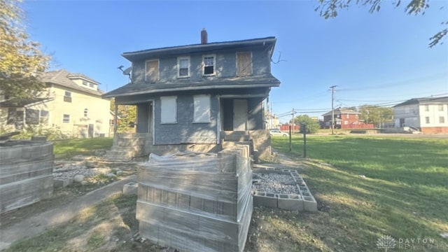 16 E Hudson Ave Unit 14, Dayton, OH 45405 - back of house featuring a yard, brick siding, and a chimney