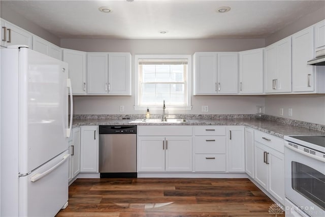 1129 Eureka Dr, Kettering, OH 45419 - kitchen with white appliances, white cabinetry, dark wood-style floors, light stone countertops, and recessed lighting