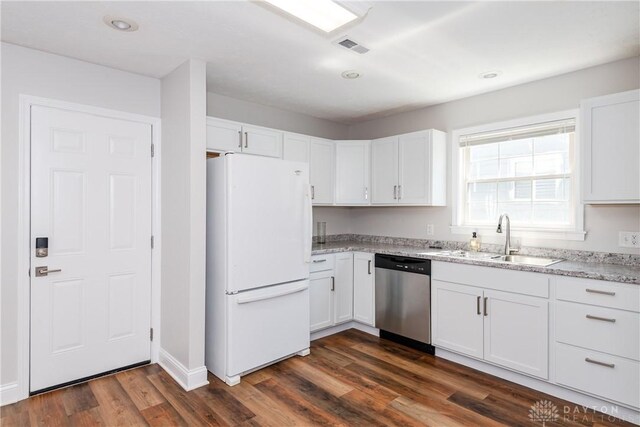1129 Eureka Dr, Kettering, OH 45419 - kitchen with freestanding refrigerator, stainless steel dishwasher, white cabinetry, light stone counters, and dark wood-type flooring