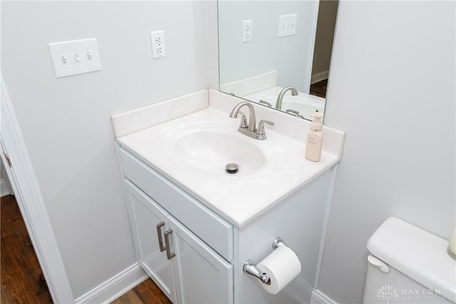 1129 Eureka Dr, Kettering, OH 45419 - half bath featuring vanity and wood finished floors