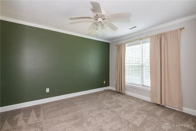 1129 Eureka Dr, Kettering, OH 45419 - carpeted empty room featuring ornamental molding and ceiling fan