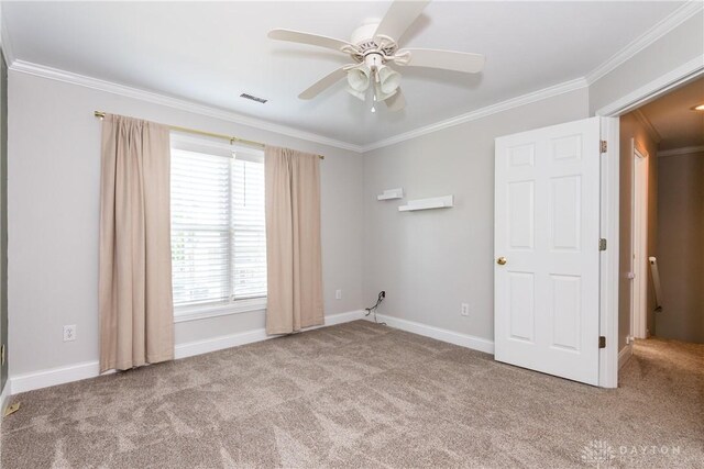 1129 Eureka Dr, Kettering, OH 45419 - carpeted spare room with ornamental molding and ceiling fan