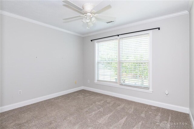 1129 Eureka Dr, Kettering, OH 45419 - carpeted spare room featuring crown molding and a ceiling fan