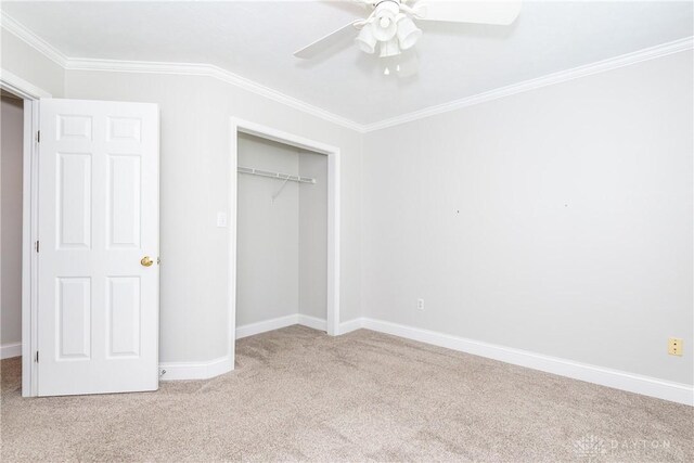 1129 Eureka Dr, Kettering, OH 45419 - unfurnished bedroom with carpet flooring, crown molding, a closet, and a ceiling fan