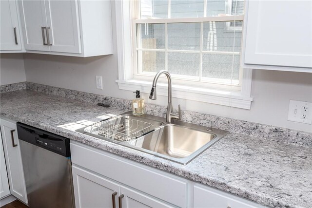 1129 Eureka Dr, Kettering, OH 45419 - kitchen with dishwasher and white cabinets