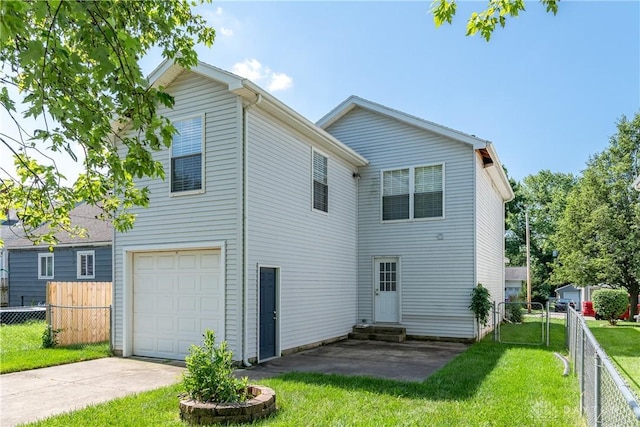 1129 Eureka Dr, Kettering, OH 45419 - back of property with entry steps, an attached garage, and concrete driveway