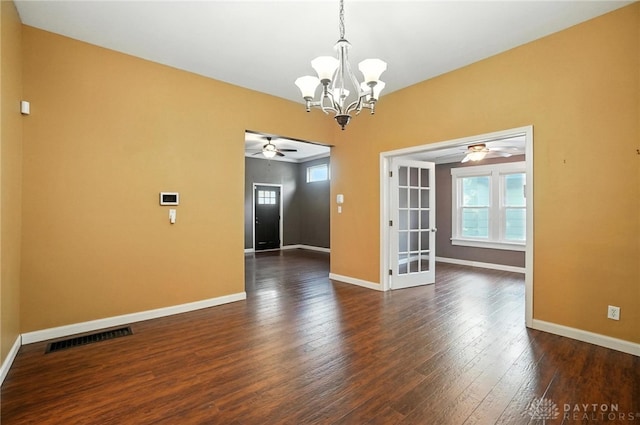 118 Hill St, Xenia, OH 45385 - spare room with a ceiling fan, a chandelier, plenty of natural light, and dark wood finished floors