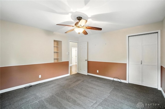118 Hill St, Xenia, OH 45385 - unfurnished bedroom featuring dark colored carpet, a ceiling fan, and a closet