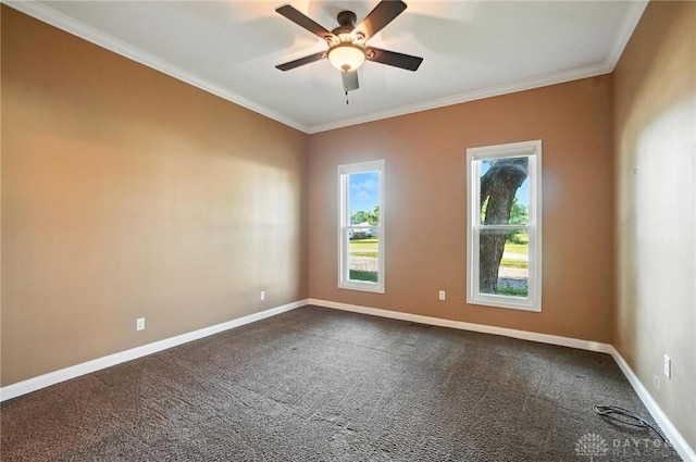118 Hill St, Xenia, OH 45385 - spare room with dark colored carpet, crown molding, and a ceiling fan