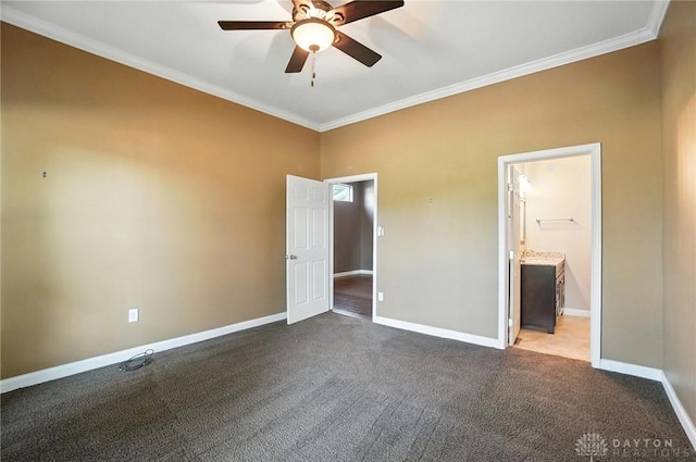118 Hill St, Xenia, OH 45385 - unfurnished bedroom with ornamental molding, dark colored carpet, connected bathroom, and a ceiling fan