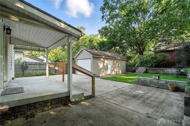 118 Hill St, Xenia, OH 45385 - view of patio / terrace with an outdoor structure and a garage