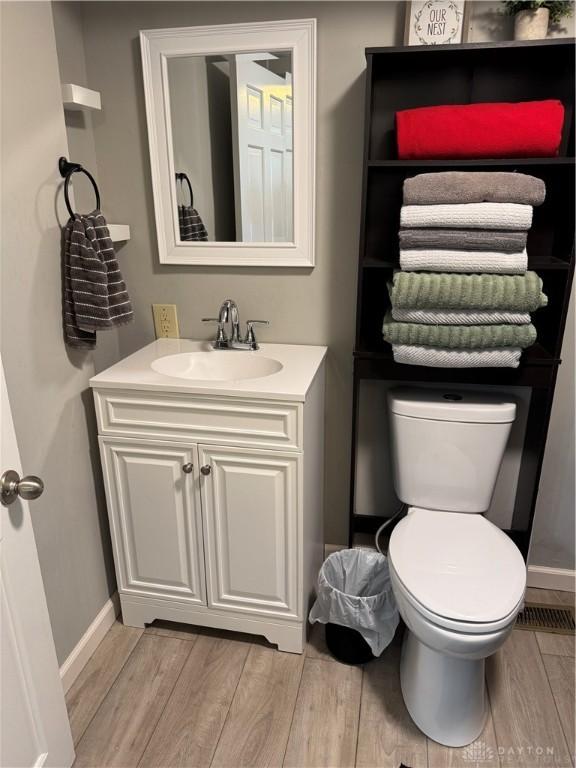 6346 Apache St, Dayton, OH 45424 - bathroom with vanity and wood finished floors