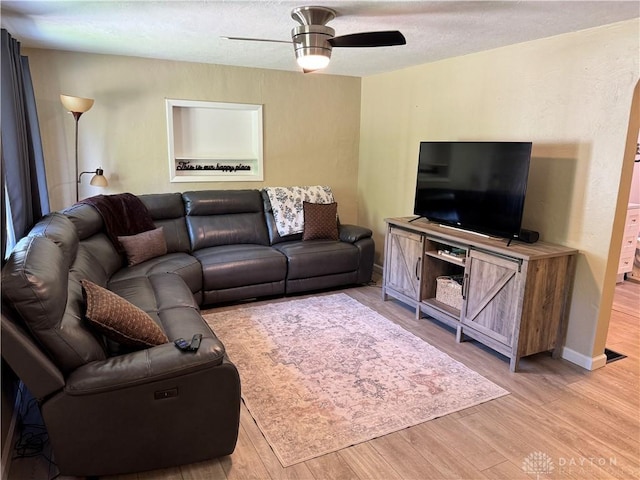 6346 Apache St, Dayton, OH 45424 - living room featuring a ceiling fan, light wood-style floors, and a textured ceiling