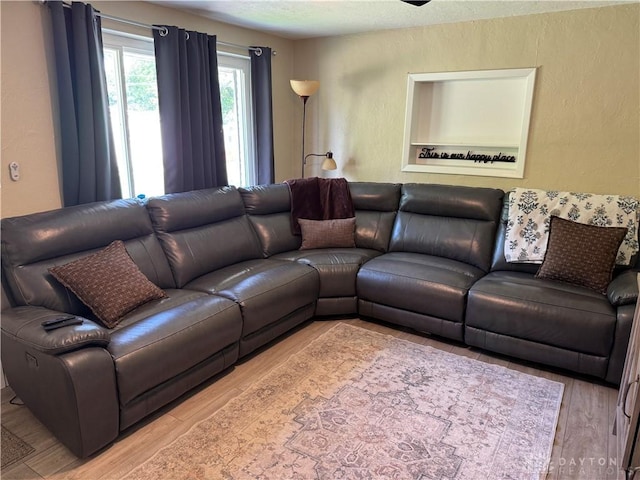 6346 Apache St, Dayton, OH 45424 - living room with wood finished floors and a textured wall