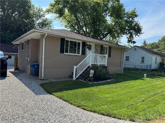 6346 Apache St, Dayton, OH 45424 - ranch-style home with brick siding and an outbuilding
