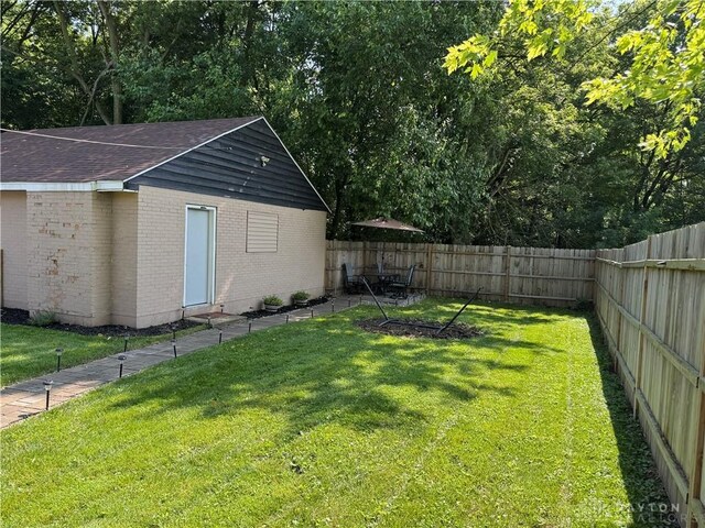 6346 Apache St, Dayton, OH 45424 - fenced backyard with an outdoor structure