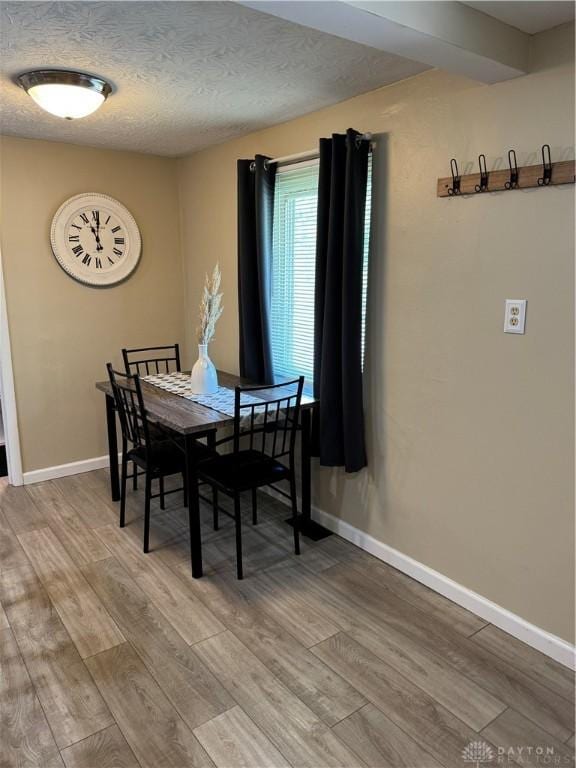 6346 Apache St, Dayton, OH 45424 - dining area with light wood-type flooring and a textured ceiling