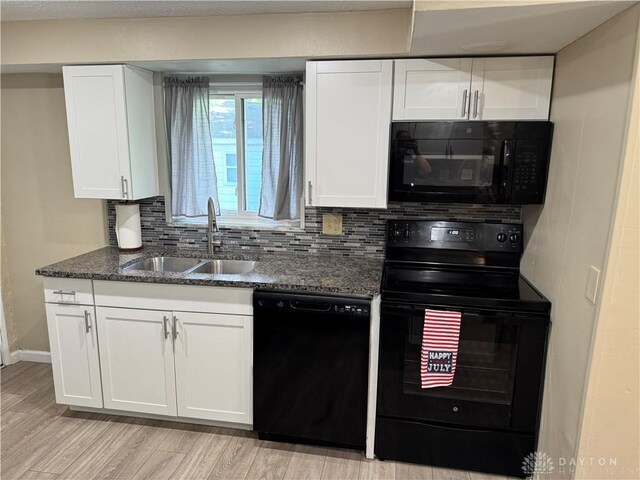 6346 Apache St, Dayton, OH 45424 - kitchen featuring black appliances, decorative backsplash, white cabinets, and light wood-style flooring