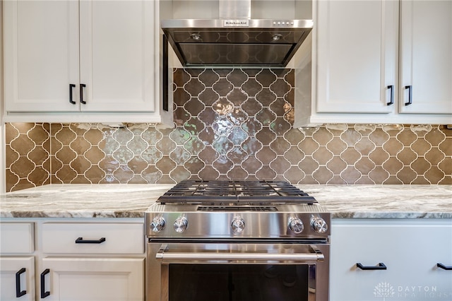 1461 Abbey Park Pl, Beavercreek Twp, OH 45385 - kitchen with high end range, range hood, white cabinets, and light stone countertops